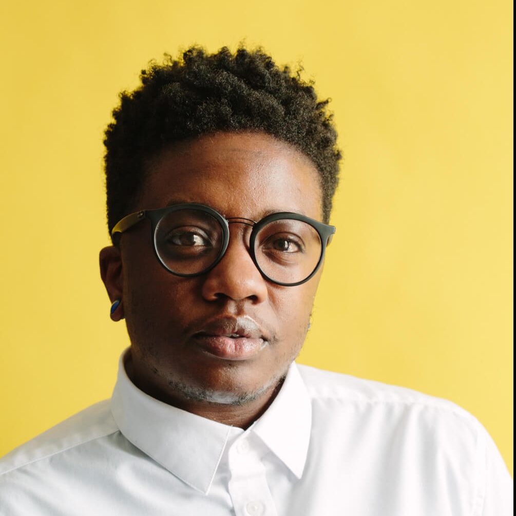 Image of Mars Marshall in front of yellow background.